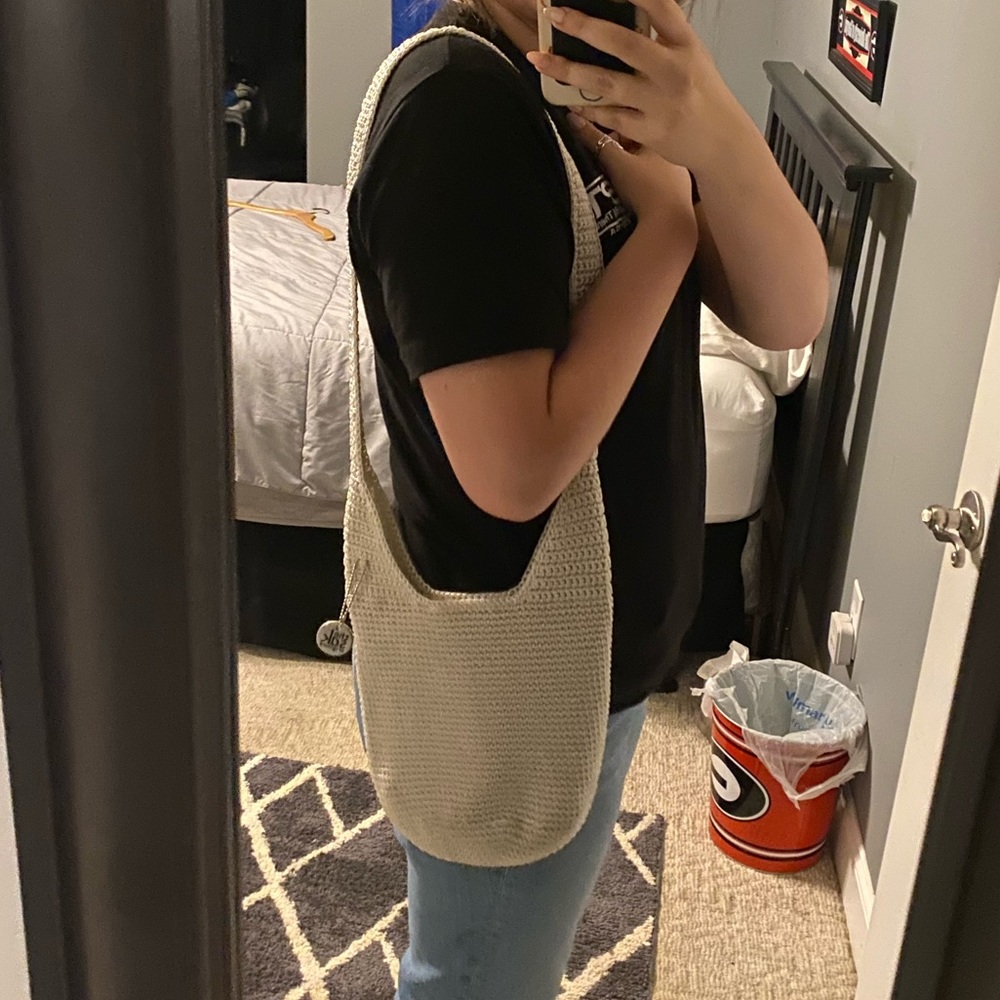 The Sak shoulder bag in a cream color.